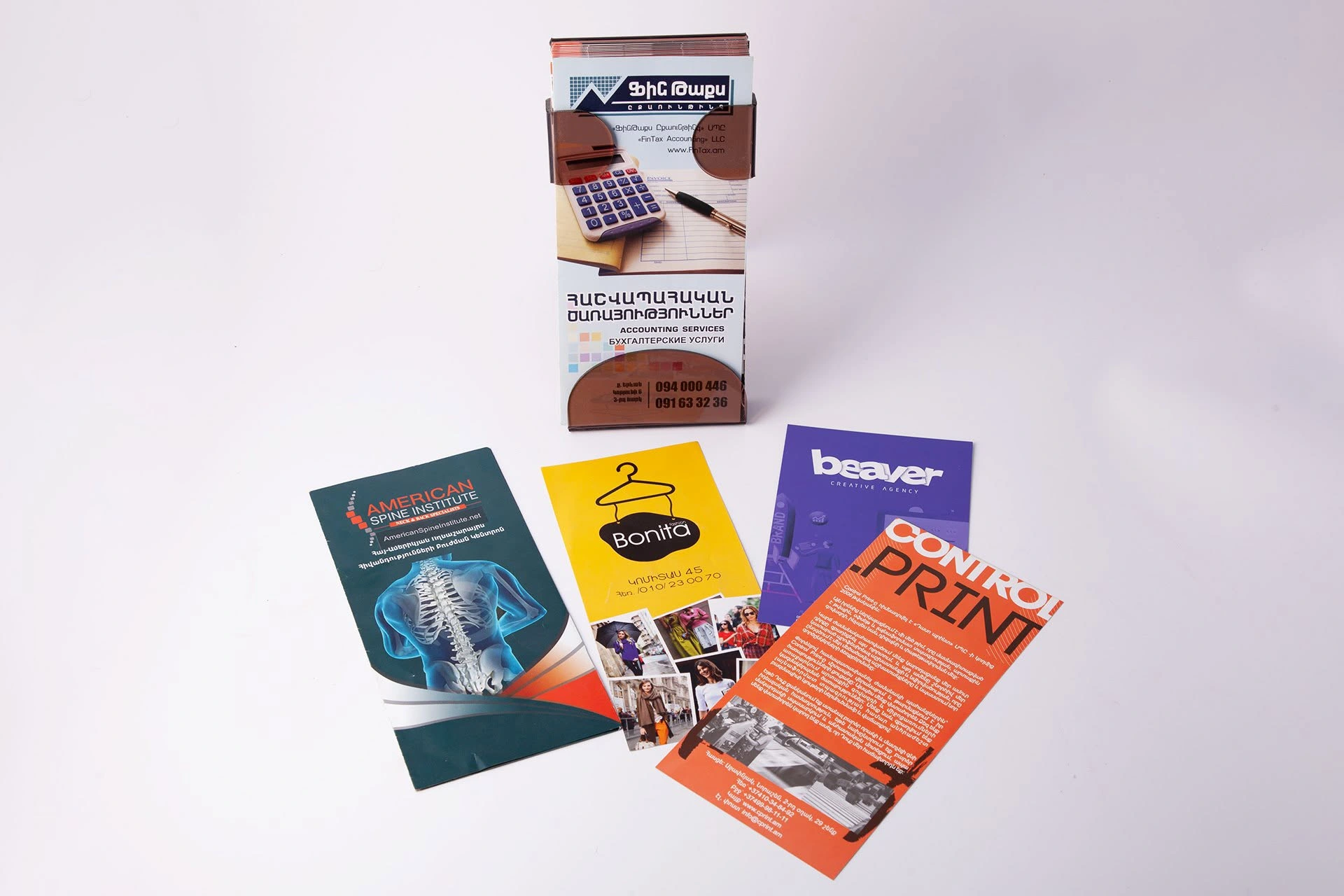 A collection of promotional booklets and flyers for different organisations. The photograph shows colour printing, folds and the formats of the finished materials.